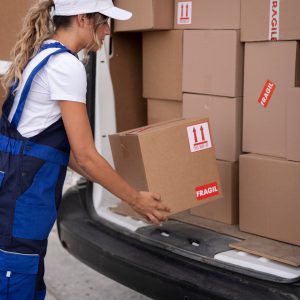 close-up-woman-holding-box_23-2149103405